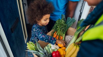 young girl going through grocery basket